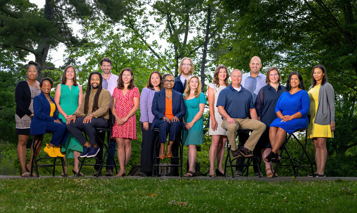 Trust staff members pose for a group picture under the trees