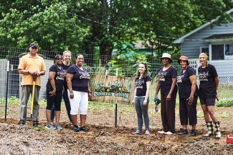 a group of workers on a community farm
